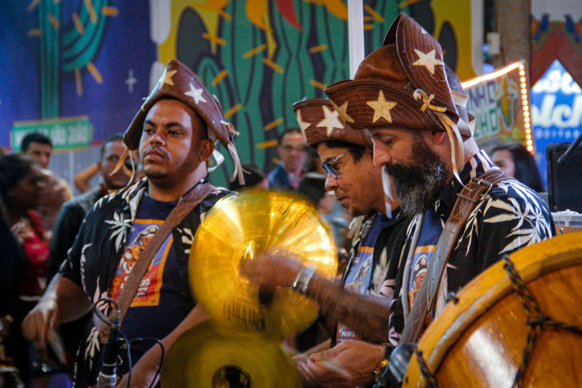 A folk band drumming at a neighbourhood street festival
